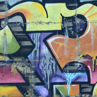 Grafiti çizimler parçası. Eski duvar boya lekeleri sokak sanatı kültür tarzı ile dekore edilmiştir. Renkli arka plan doku sıcak tonları içinde.