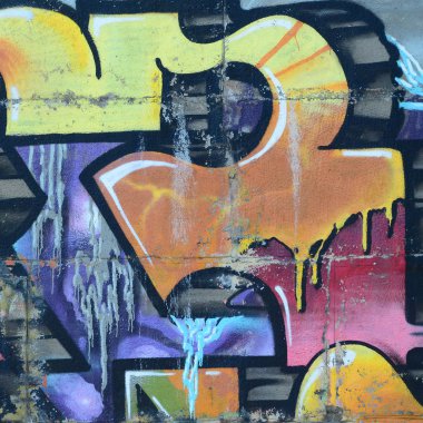 Grafiti çizimler parçası. Eski duvar boya lekeleri sokak sanatı kültür tarzı ile dekore edilmiştir. Renkli arka plan doku sıcak tonları içinde.