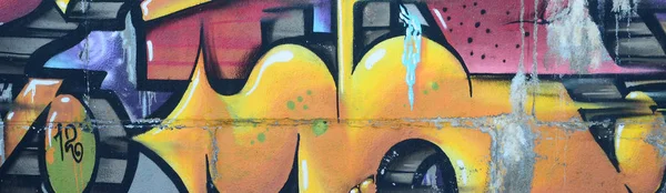 Grafiti çizimler parçası. Eski duvar boya lekeleri sokak sanatı kültür tarzı ile dekore edilmiştir. Renkli arka plan doku sıcak tonları içinde.