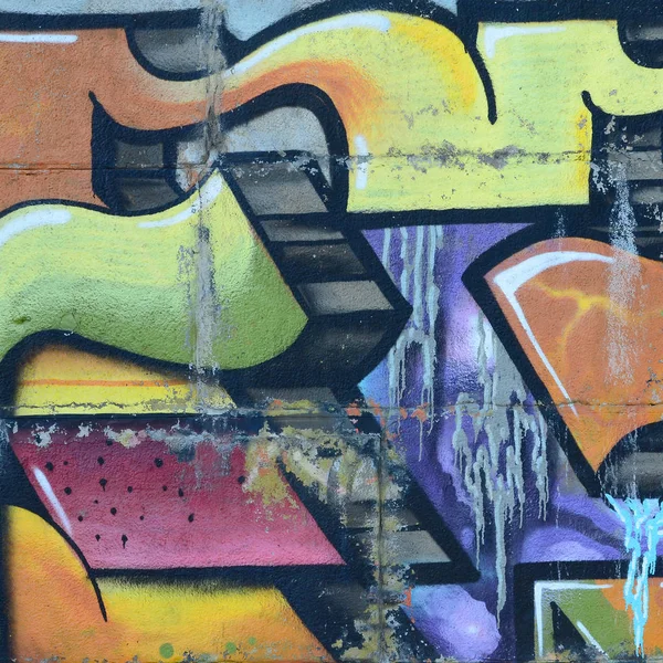 Grafiti çizimler parçası. Eski duvar boya lekeleri sokak sanatı kültür tarzı ile dekore edilmiştir. Renkli arka plan doku sıcak tonları içinde.