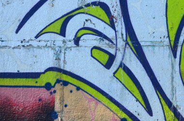 Grafiti çizimler parçası. Eski duvar boya lekeleri sokak sanatı kültür tarzı ile dekore edilmiştir. Yeşil tonlarında renkli arka plan doku.