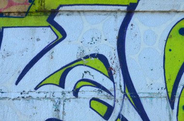 Grafiti çizimler parçası. Eski duvar boya lekeleri sokak sanatı kültür tarzı ile dekore edilmiştir. Yeşil tonlarında renkli arka plan doku.