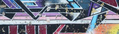 Grafiti çizimler parçası. Eski duvar boya lekeleri sokak sanatı kültür tarzı ile dekore edilmiştir. Çok renkli arka plan dokusu.