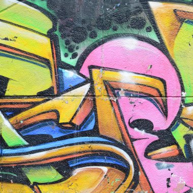 Grafiti çizimler parçası. Eski duvar boya lekeleri sokak sanatı kültür tarzı ile dekore edilmiştir. Çok renkli arka plan dokusu.
