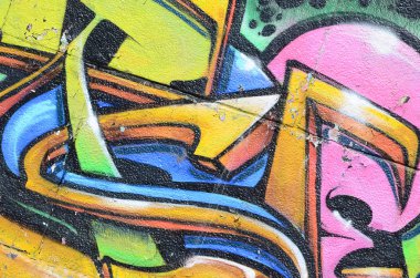 Grafiti çizimler parçası. Eski duvar boya lekeleri sokak sanatı kültür tarzı ile dekore edilmiştir. Çok renkli arka plan dokusu.