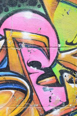 Grafiti çizimler parçası. Eski duvar boya lekeleri sokak sanatı kültür tarzı ile dekore edilmiştir. Çok renkli arka plan dokusu.