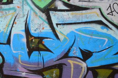 Grafiti çizimler parçası. Eski duvar boya lekeleri sokak sanatı kültür tarzı ile dekore edilmiştir. Renkli arka plan doku soğuk tonlarda.