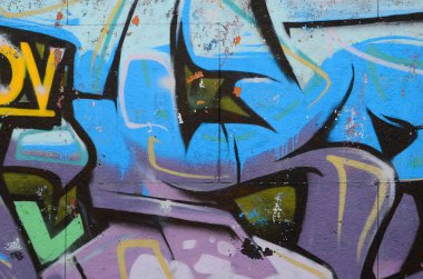 Grafiti çizimler parçası. Eski duvar boya lekeleri sokak sanatı kültür tarzı ile dekore edilmiştir. Renkli arka plan doku soğuk tonlarda.