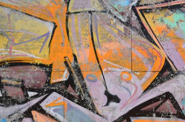 Grafiti çizimler parçası. Eski duvar boya lekeleri sokak sanatı kültür tarzı ile dekore edilmiştir. Renkli arka plan doku sıcak tonları içinde.