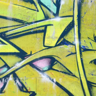 Grafiti çizimler parçası. Eski duvar boya lekeleri sokak sanatı kültür tarzı ile dekore edilmiştir. Yeşil tonlarında renkli arka plan doku.