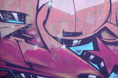 Grafiti çizimler parçası. Eski duvar boya lekeleri sokak sanatı kültür tarzı ile dekore edilmiştir. Renkli arka plan doku sıcak tonları içinde.