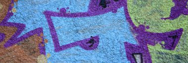 Grafiti çizimler parçası. Eski duvar boya lekeleri sokak sanatı kültür tarzı ile dekore edilmiştir. Renkli arka plan doku sıcak tonları içinde.