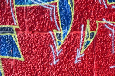 Grafiti çizimler parçası. Eski duvar boya lekeleri sokak sanatı kültür tarzı ile dekore edilmiştir. Renkli arka plan doku sıcak tonları içinde.