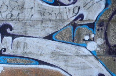 Grafiti çizimler parçası. Eski duvar boya lekeleri sokak sanatı kültür tarzı ile dekore edilmiştir. Renkli arka plan doku sıcak tonları içinde.