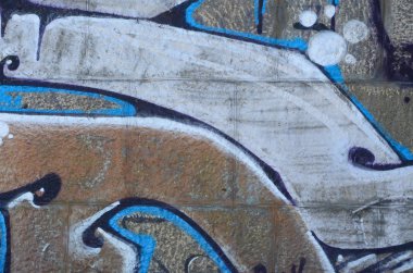 Grafiti çizimler parçası. Eski duvar boya lekeleri sokak sanatı kültür tarzı ile dekore edilmiştir. Renkli arka plan doku sıcak tonları içinde.