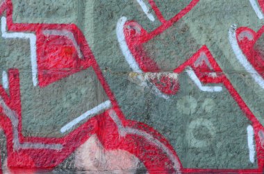 Grafiti çizimler parçası. Eski duvar boya lekeleri sokak sanatı kültür tarzı ile dekore edilmiştir. Renkli arka plan doku sıcak tonları içinde.