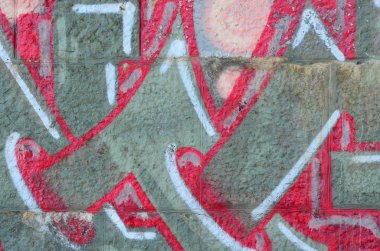 Grafiti çizimler parçası. Eski duvar boya lekeleri sokak sanatı kültür tarzı ile dekore edilmiştir. Renkli arka plan doku sıcak tonları içinde.