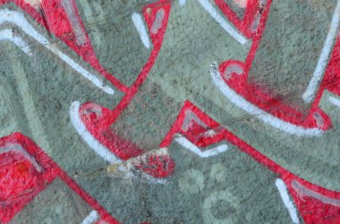 Grafiti çizimler parçası. Eski duvar boya lekeleri sokak sanatı kültür tarzı ile dekore edilmiştir. Renkli arka plan doku sıcak tonları içinde.