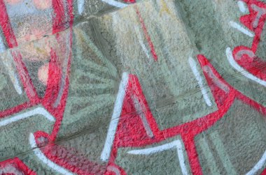 Grafiti çizimler parçası. Eski duvar boya lekeleri sokak sanatı kültür tarzı ile dekore edilmiştir. Renkli arka plan doku sıcak tonları içinde.