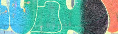 Grafiti çizimler parçası. Eski duvar boya lekeleri sokak sanatı kültür tarzı ile dekore edilmiştir. Yeşil tonlarında renkli arka plan doku.