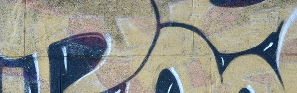 落書き図面のフラグメント 古い壁塗料の汚れストリート アート文化のスタイルで飾られています 温かみのある色調で色付きの背景テクスチャ ストック画像