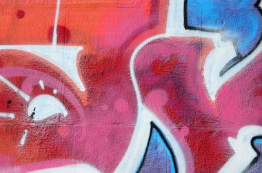 Grafiti çizimler parçası. Eski duvar boya lekeleri sokak sanatı kültür tarzı ile dekore edilmiştir. Renkli arka plan doku sıcak tonları içinde.