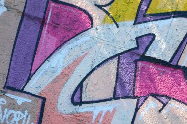 Grafiti çizimler parçası. Eski duvar boya lekeleri sokak sanatı kültür tarzı ile dekore edilmiştir. Renkli arka plan doku sıcak tonları içinde.