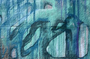 Grafiti çizimler parçası. Eski duvar boya lekeleri sokak sanatı kültür tarzı ile dekore edilmiştir. Çok renkli arka plan dokusu.
