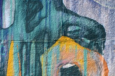 Grafiti çizimler parçası. Eski duvar boya lekeleri sokak sanatı kültür tarzı ile dekore edilmiştir. Renkli arka plan doku sıcak tonları içinde.