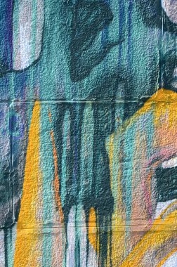 Grafiti çizimler parçası. Eski duvar boya lekeleri sokak sanatı kültür tarzı ile dekore edilmiştir. Renkli arka plan doku sıcak tonları içinde.