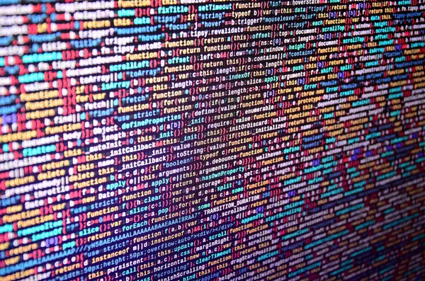 Software developer programming code on computer. Abstract computer script source code. Shallow depth of field, selective focus effect