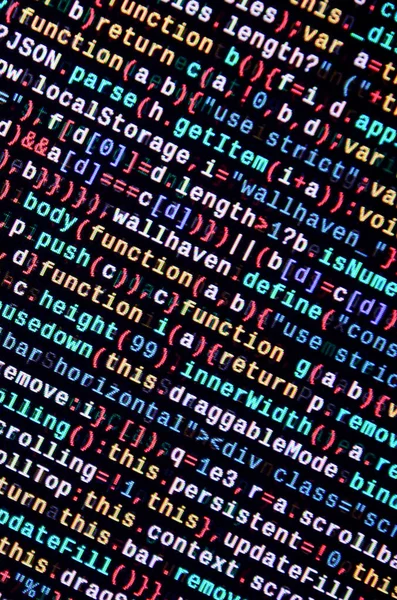 JavaScript code in text editor. Coding cyberspace concept. Screen of web developing javascript code. Implementing SEO concepts for better SERP. HTML markup language closeup. Website design