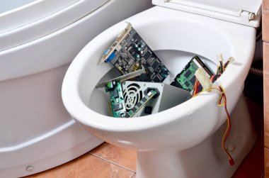 Obsolete technology concept with a toilet bowl. Old and unused computer details is recycled in the trash clipart