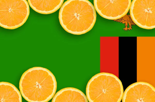 Zambia flag  in horizontal frame of orange citrus fruit slices. Concept of growing as well as import and export of citrus fruits