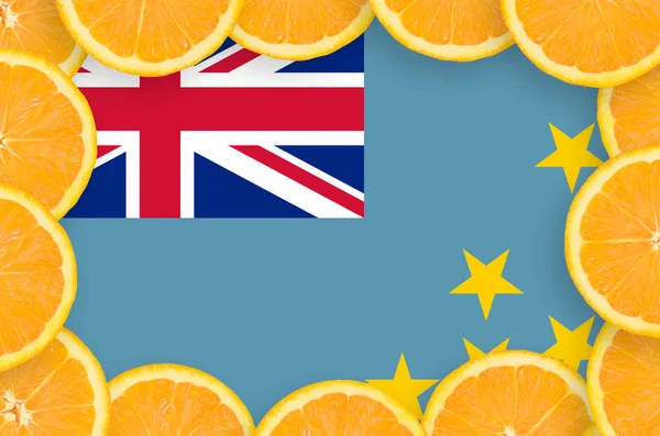 Tuvalu flag  in frame of orange citrus fruit slices. Concept of growing as well as import and export of citrus fruits