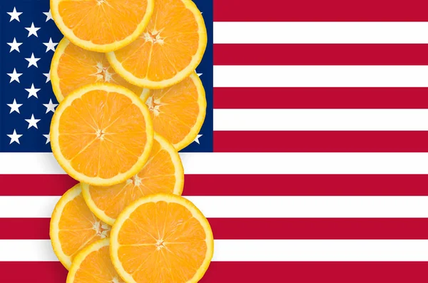 United States of America flag and vertical row of orange citrus fruit slices. Concept of growing as well as import and export of citrus fruits