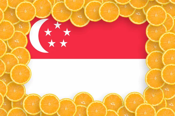 Singapore flag  in frame of orange citrus fruit slices. Concept of growing as well as import and export of citrus fruits