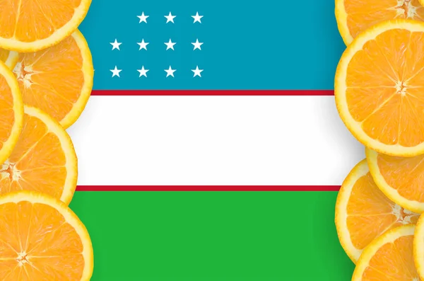 Uzbekistan flag  in vertical frame of orange citrus fruit slices. Concept of growing as well as import and export of citrus fruits