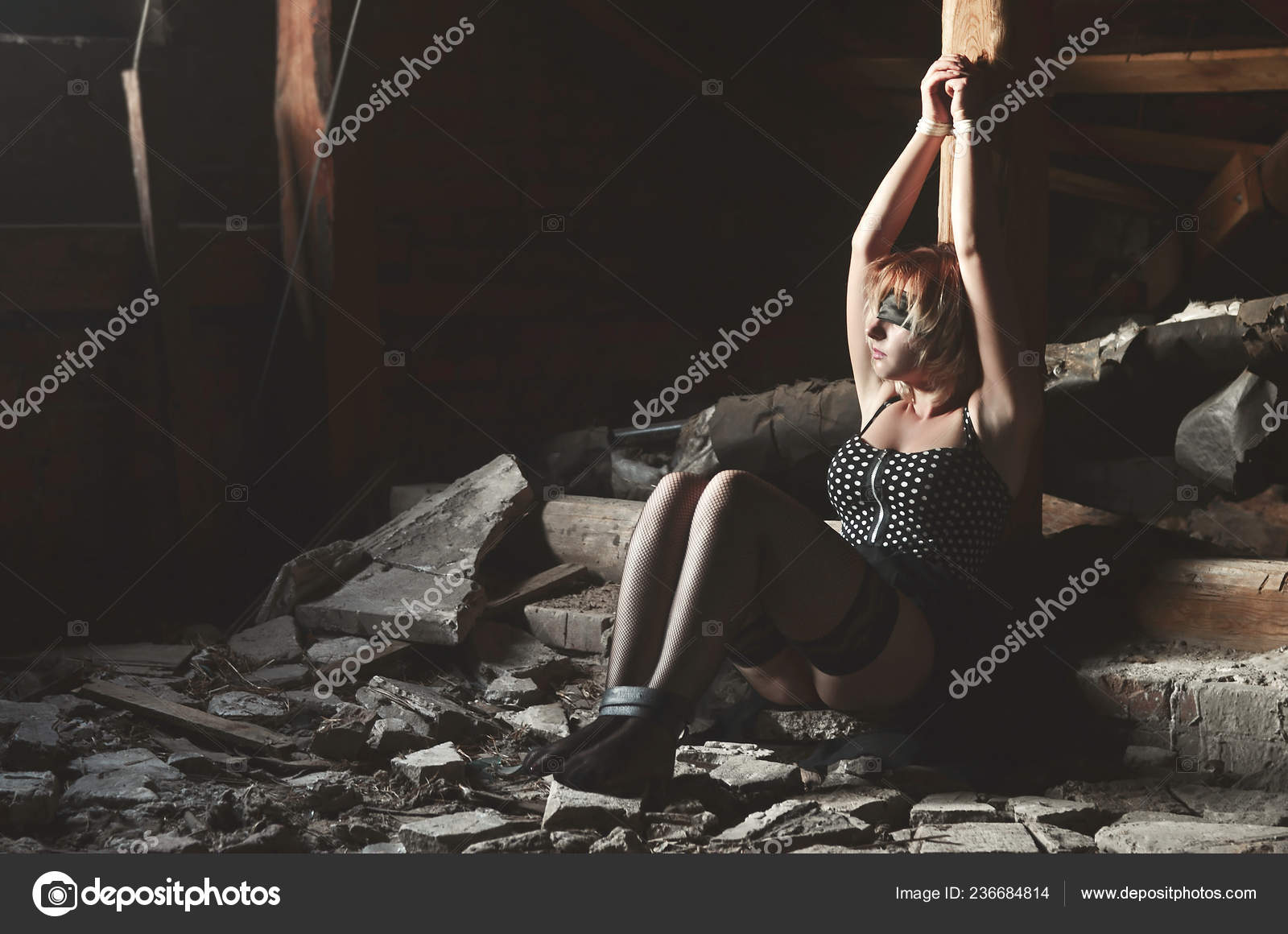 Black dude tied to pole