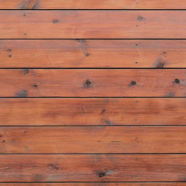 Varnished wood background from cabin exterior. Brown wood barn plank rough grain surface background