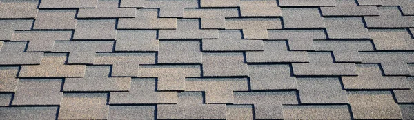 Modern roofing and decoration of chimneys. Flexible bitumen or slate shingles in rectangular shape in perspective.