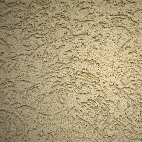 The texture of the beige decorative plaster in bark beetle style. Russian variation of decorating facade walls — Stock Image Texture Beige Decorative Plaster Bark Beetle Style Russian Variation Decorating Royalty Free Stock Photos