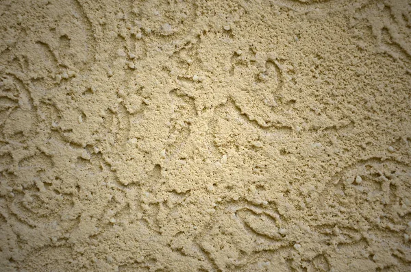 The texture of the beige decorative plaster in bark beetle style. Russian variation of decorating facade walls — Stock Image Texture Beige Decorative Plaster Bark Beetle Style Russian Variation Decorating Royalty Free Stock Images