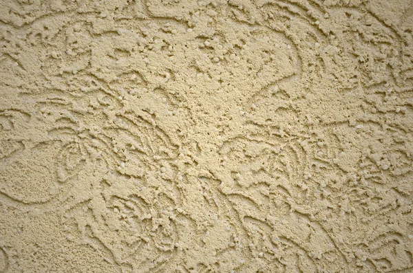 The texture of the beige decorative plaster in bark beetle style. Russian variation of decorating facade walls — Stock Image Texture Beige Decorative Plaster Bark Beetle Style Russian Variation Decorating Stock Photo