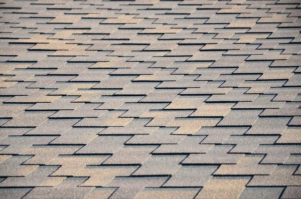 Modern roofing and decoration of chimneys. Flexible bitumen or slate shingles in rectangular shape in perspective.