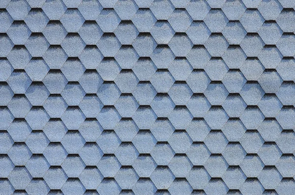 Modern roofing and decoration of chimneys. Flexible bitumen or slate shingles in hexagon shape. Top view texture