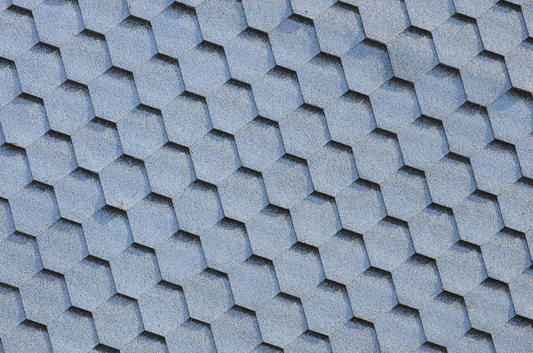 Modern roofing and decoration of chimneys. Flexible bitumen or slate shingles in hexagon shape. Top view texture