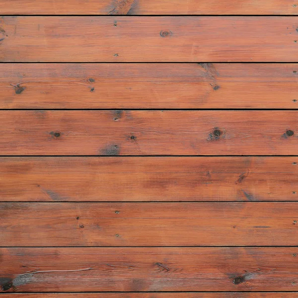 Varnished wood background from cabin exterior. Brown wood barn plank rough grain surface background