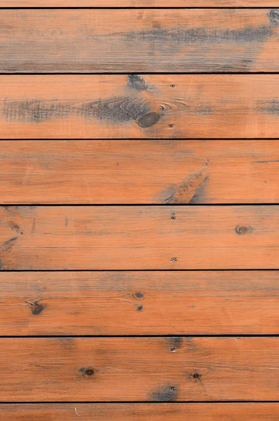 Varnished wood background from cabin exterior. Brown wood barn plank rough grain surface background