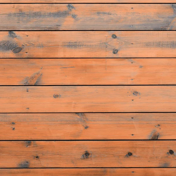 Varnished wood background from cabin exterior. Brown wood barn plank rough grain surface background